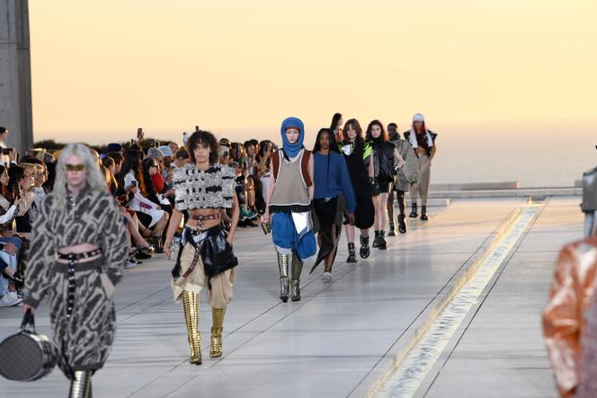 A model walks on the runway at the Louis Vuitton fashion show