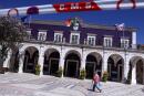 A man passes by Setubal City Hall as investigations over allegations that personal data of newly-arrived Ukrainians to the municipality were collected by pro-Kremlin Russians are on their way, in Setubal, Portugal, May 10, 2022. REUTERS/Pedro Nunes