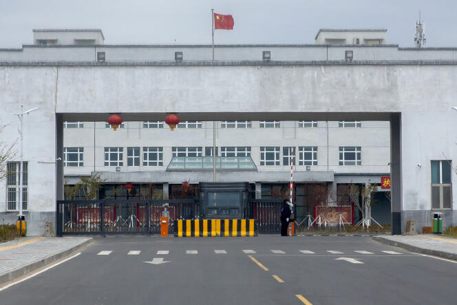 Police officers stand at the outer entrance of the Urumqi No. 3 Detention Center in Dabancheng in western China's Xinjiang Uyghur Autonomous Region on April 23, 2021. 