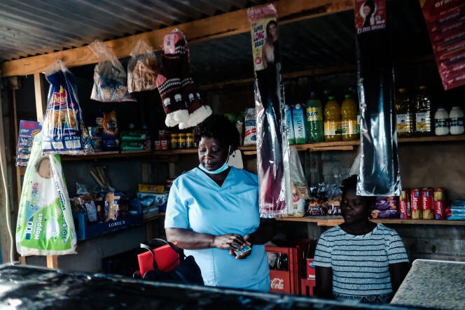 Virginia Mutsamwira, 52, is a nurse in a public hospital in Harare, the capital of Zimbabwe. After a 12-hour shift, on April 25, 2022, she comes to work in the small shop she owns to make ends meet.