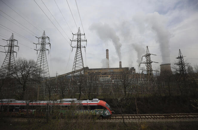 A train passes in front of the Republika power plant in Pernik, Bulgaria, on April 21, 2022. The Pernik power plant is the only nuclear power plant in Bulgaria. It generates more than a third of the country's electricity and runs on uranium from Russia.