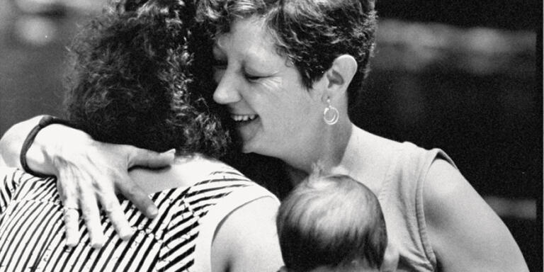 Feminist Norma McCorvey aka Jane Roe, the woman behind Roe V. Wade case, hugging her 23 yr. old daughter, Cheryl while holding her baby granddaughter outside at hotel. (Photo by Mark Perlstein/Getty Images)