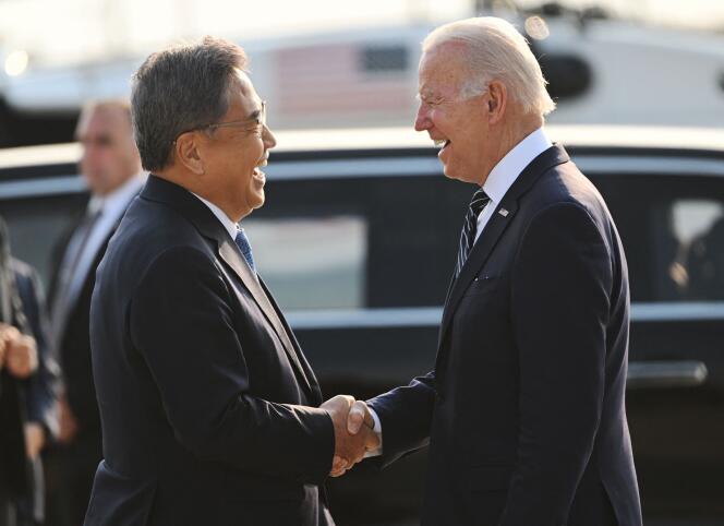 US President Joe Biden (R) shakes hands with South Korea's Foreign Minister Park Jin upon arriving at Osan Air Base in Pyeongtaek on May 20, 2022.  