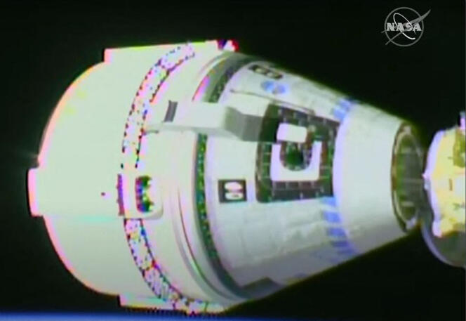 In this handout video grab courtesy of NASA TV, Boeing's Starliner capsule (L) docks with the International Space Station (ISS) on May 20, 2022.