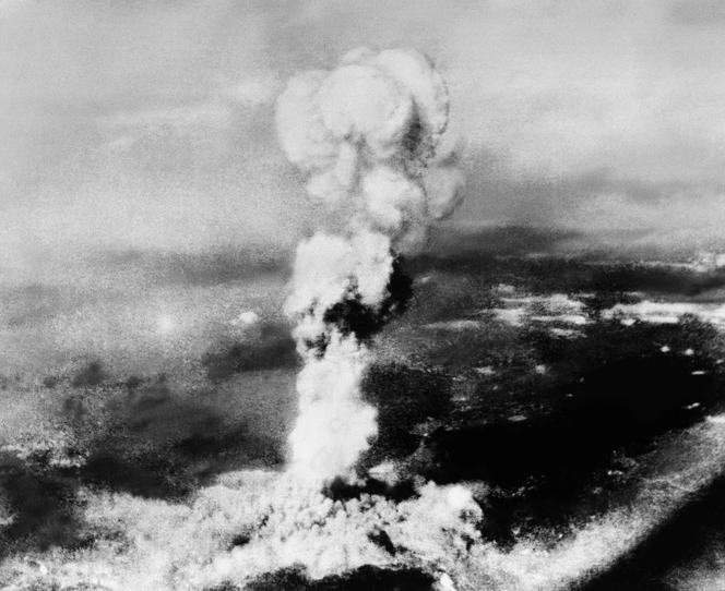 This photo provided by the U.S. Air Force, taken from the town of Yoshiura, across the mountain north of Hiroshima, Japan, shows smoke rising from the atomic bomb explosion in Hiroshima, August 6, 1945.