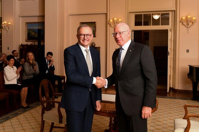 Newly sworn-in Australian Prime Minister Anthony Albanese shakes hands with Australian Governor-General David Hurley during a ceremony at Government House in Canberra, May 23, 2022.