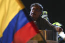 Colombian presidential left-wing candidate Gustavo Petro, speaks during his closing campaign rally at the Bolivar square in Bogota, Colombia on May 22, 2022. - Petro is leading the polls for the upcoming presidential election next May 29. (Photo by Yuri CORTEZ / AFP)