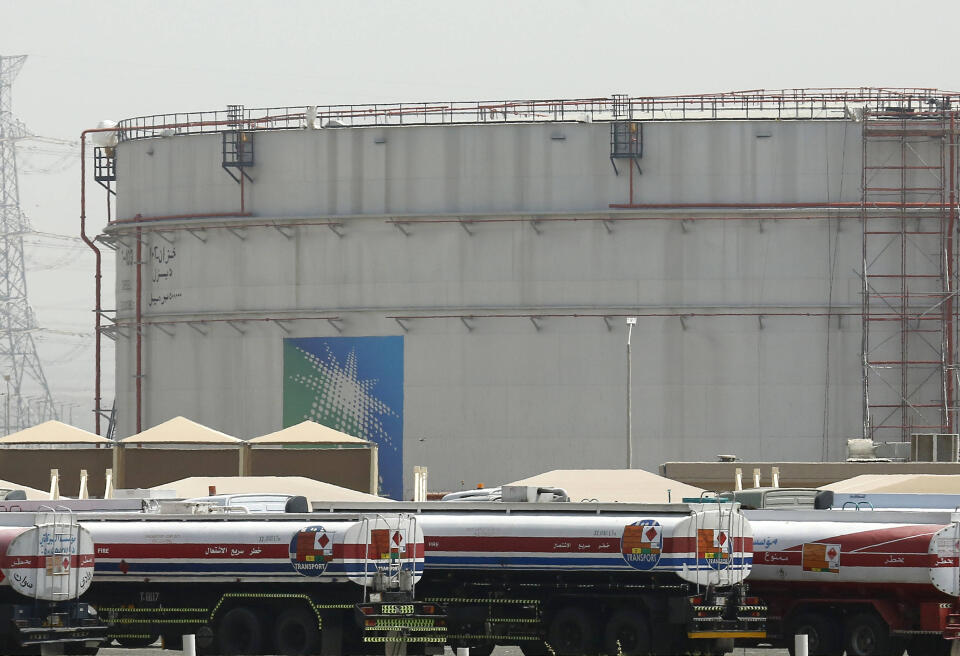 FILE - Fuel trucks line up in front of storage tanks at the North Jiddah bulk plant, an Aramco oil facility, in Jiddah, Saudi Arabia, on March 21, 2021. The leaders OPEC and its oil-producing allies are deciding Wednesday, March 2, 2022 how much oil to release while Russia's invasion of Ukraine rattles markets, reshapes alliances, kills civilians and sends the price of crude skyrocketing. (AP Photo/Amr Nabil, File)/LBL101/22061365024855/MARCH 21, 2021 FILE PHOTO/2203021115