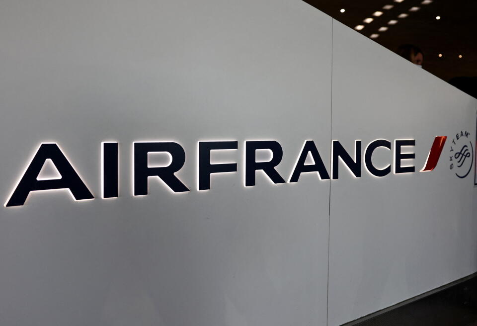 FILE PHOTO: The logo of airline company Air France is seen inside the Terminal 2 at Paris Charles de Gaulle airport in Roissy-en-France near Paris, France, December 2, 2021. REUTERS/Sarah Meyssonnier/File Photo