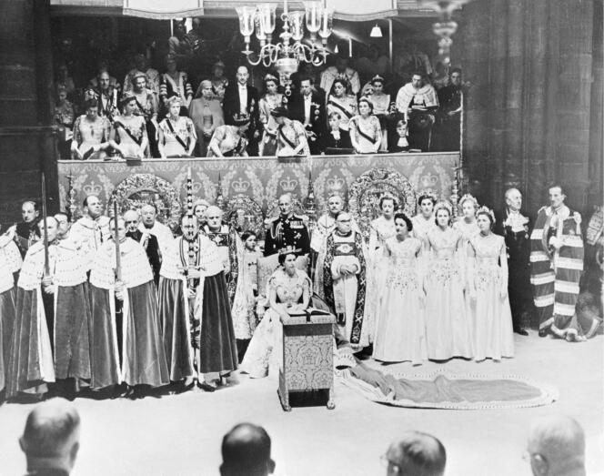 Britain's Queen Elizabeth II (C) sits in Westminster Abbey on London on June 2, 1953 during her coronation.  