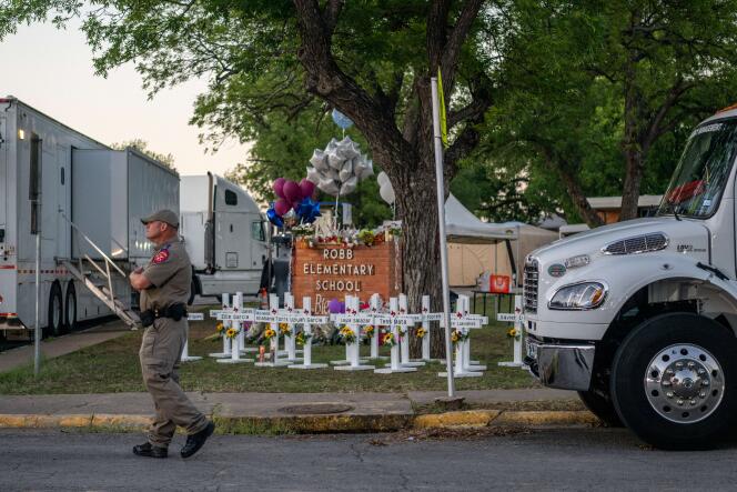 A law enforcement officer patrols around Robb Elementary in Uvalde, Texas, on May 26, 2022.