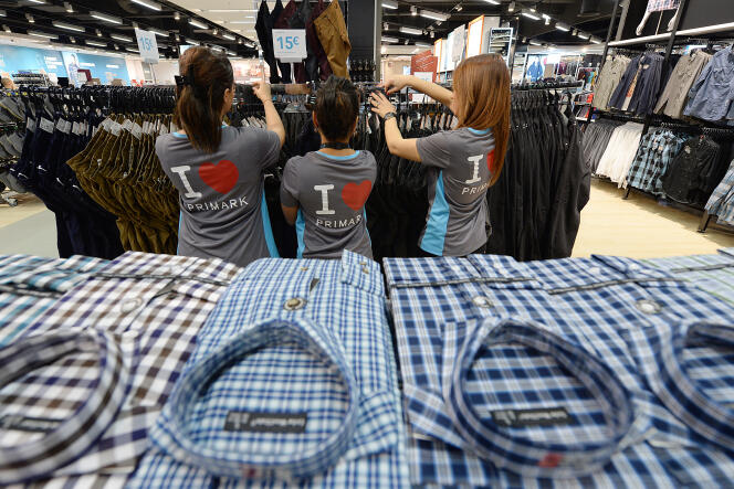 Employees of the first Primark opened in France arrange the clothes racks prior to the store opening, on December 16, 2013 in Marseille. 