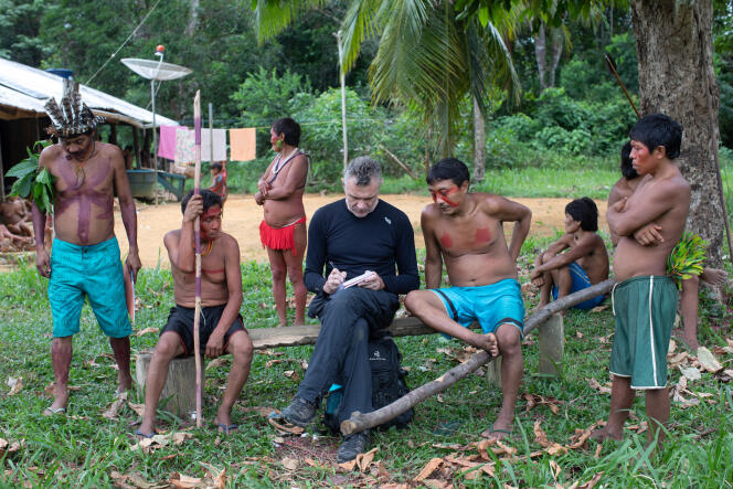 Dom Phillips talks to indigenous people in Altea Maloca Papiu in Roraima province, Brazil in November 2019.