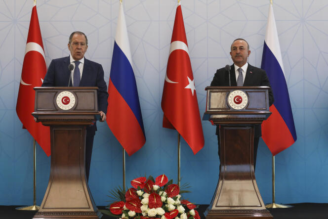 Russian Foreign Minister Sergey Lavrov, left, talks to journalists next to Turkish Foreign Minister Mevlut Cavusoglu during a joint news conference in Ankara, Wednesday, June 8, 2022.