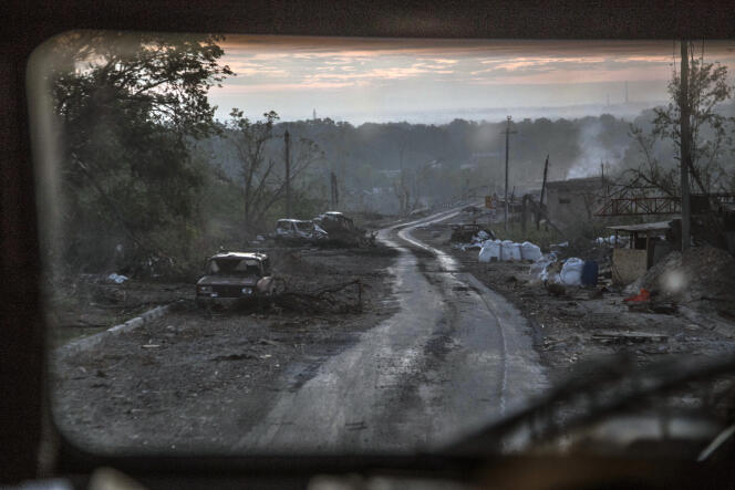 The gutted remains of cars sit along a road during heavy fighting at the front line in Severodonetsk in the Luhansk region of Ukraine, Wednesday, June 8, 2022.