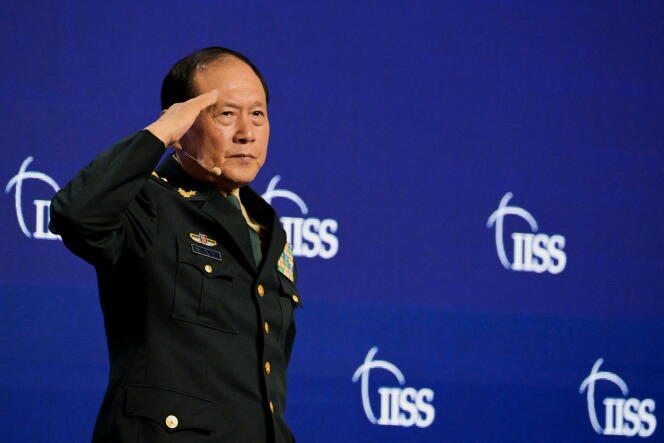 Chinese Defense Minister General Wei Fenghe gives a military salute during the Shangri-La dialogue in Singapore on June 12, 2022.