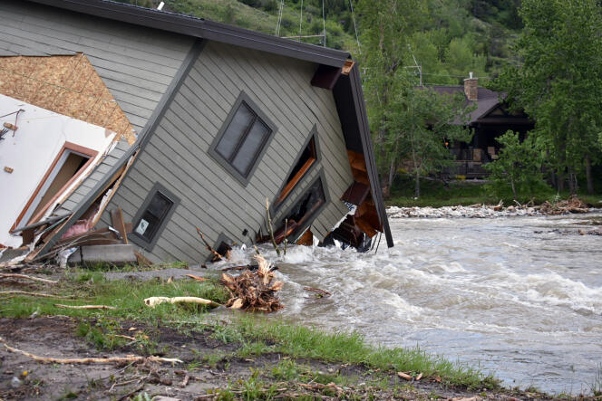 A collapsed house due to river flooding in Red Lodge, Montana on June 14, 2022.