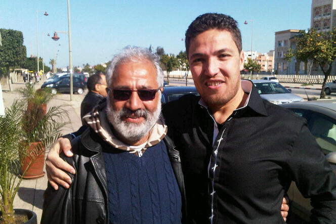 Former kickboxing champion Zakaria Moumni poses with Taib Madmad, a member of the Moroccan Association of Human Rights, upon Mr. Moumni's release from prison in the town of Sale, northeast of Rabat, Feb. 4, 2012.