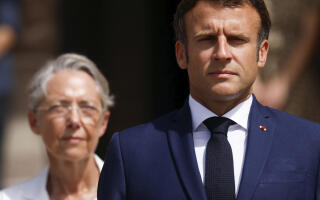 French President Emmanuel Macron and Prime Minister Elisabeth Borne attend a ceremony marking the 82nd anniversary of late French General Charles de Gaulle's resistance call of June 18, 1940, at the Mont Valerien memorial in Suresnes near Paris, Saturday, June 18, 2022. (Gonzalo Fuentes, Pool via AP)