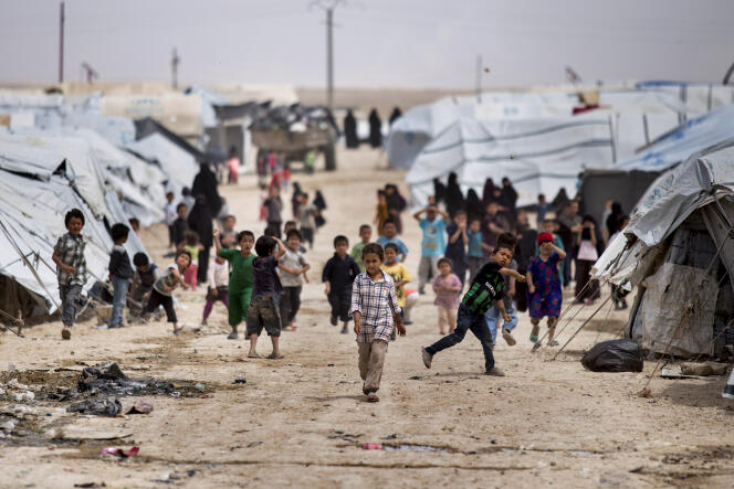 Children gather outside their tents, at al-Hol camp, which houses families of members of the Islamic State group, in Hasakeh province, Syria, May 1, 2021.