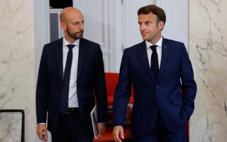 France's Minister of Transformation and Public Services and Renaissance general delegate Stanislas Guerini (L) looks at France's President Emmanuel Macron after talks at the presidential Elysee Palace, in Paris, on June 21, 2022, two days after France's legislative elections. France's President Emmanuel Macron hosts political party chiefs in a bid to break the impasse created by the failure of his coalition to win a majority in parliamentary elections. (Photo by Ludovic MARIN / POOL / AFP)