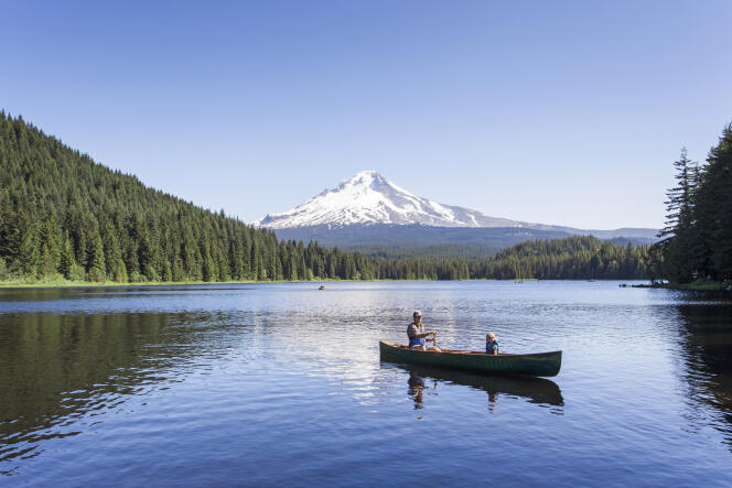 On the mountain side of the state is the snowy summit of Mount Hood (seen from Trillium Lake).