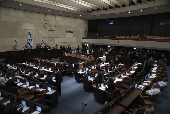 Lawmakers attend a preliminary vote on a bill to dissolve parliament at the Knesset in Jerusalem on Wednesday, June 22, 2022. 