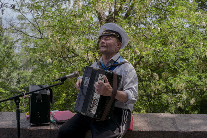 A Ukrainian musician plays accordion on the promenade along the Black Sea in Odessa, Ukraine, May 31, 2022.