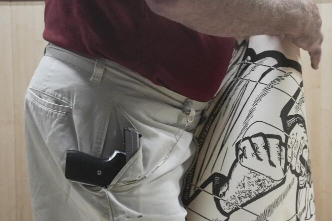 John Deloca, owner of Seneca Sporting Shooting Center, with a 9 mm semi-automatic pistol in his pocket, as he prepares to shoot at a target in New York City on June 23, 2022.