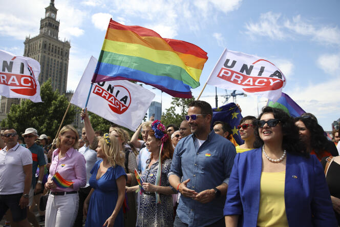 The mayor of Warsaw, Rafal Trzaskowski (second from right), and the European Commissioner for Equality, Helena Dalli (right), during the Pride March in Warsaw, June 25, 2022. 