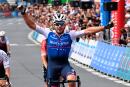 French rider Florian Senechal celebrates as he crosses the finish line to win the French Elite men championships in Cholet, western France on June 26, 2022. (Photo by DAMIEN MEYER / AFP)