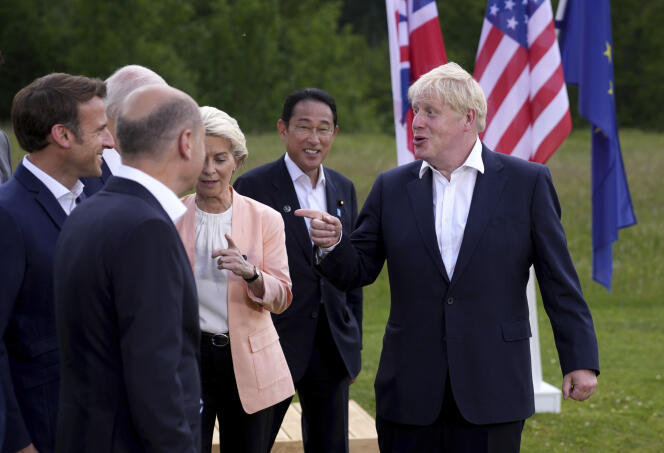 British Prime Minister Boris Johnson, right, speaks with, from left, French President Emmanuel Macron, U.S. President Joe Biden, German Chancellor Olaf Scholz, European Commission President Ursula von der Leyen and Japan's Prime Minister Fumio Kishida after the official G7 group photo in Germany, on Sunday, June 26, 2022. 