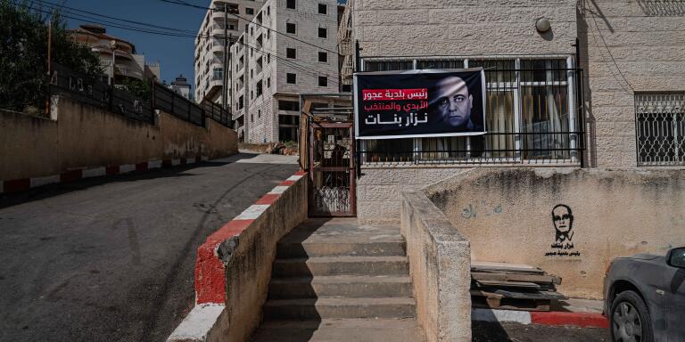 A banner bearing a portrait of murdered Palestinian activist Nizar Banat, hangs outside their home in West Bank city of Doura, southwest of Hebron, on June 28, 2022. Samar Hazboun / Le Monde