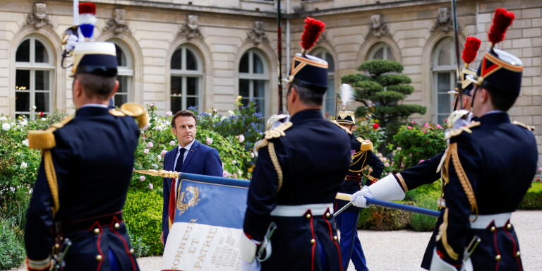 Emmanuel Macron reviews troops at the Elysee presidential palace in Paris on May 7, 2022, during his investiture ceremony as French President, following his re-election last April 24. (Photo by GONZALO FUENTES / POOL / AFP)