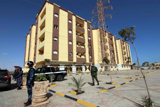 Libyan security forces stand guard outside the entrance to the Tobruk Conference Center, the building used as the parliament, on March 15, 2021.