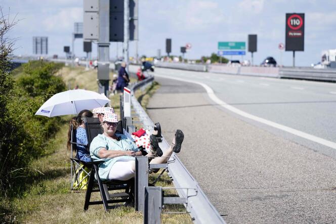 Spectators wait along the route in Halsskov near the Great Belt Bridge before the second stage of Tour de France cycling race between Roskilde and Nyborg, Denmark on July 2, 2022.