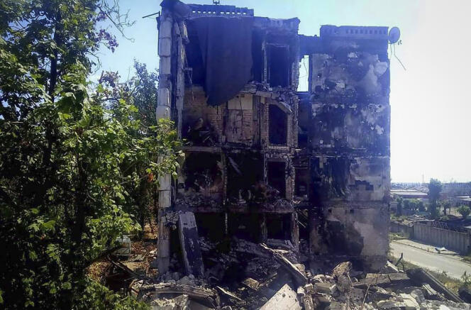 In this photo provided by the Luhansk region military administration, damaged residential buildings are seen in Lysychansk, Luhansk region, Ukraine, early Sunday, July 3, 2022. 