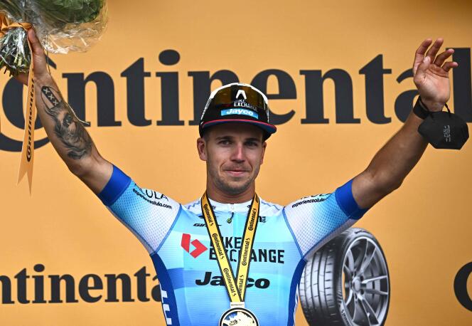 Dylan Groenewegen celebrates on the podium after the 3rd stage of the Tour de France cycling race, 182 km between Vejle and Sonderborg in Denmark, on July 3, 2022. 