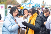 Job seekers look for information at a fair in Nantong, China, Jiangsu Province, February 8, 2022.