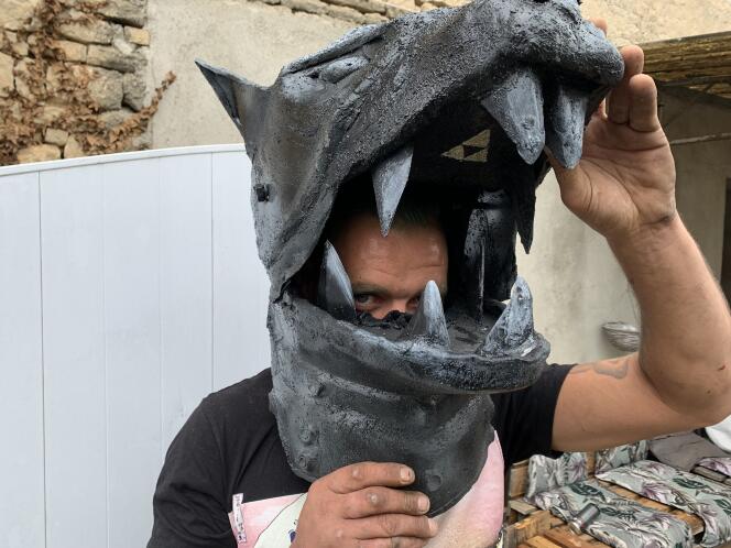 Christophe Desnoelly wears a zinc prototype of the wolf-headed mask from Le Limier, one of the main heroes of the 