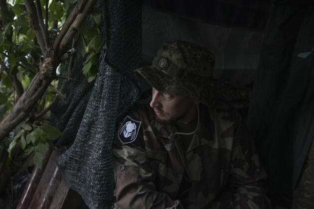 A soldier of the Dnipro-1 battalion at an observation post, hidden in the woods near Sloviansk, Donbas, Ukraine, June 25, 2022


