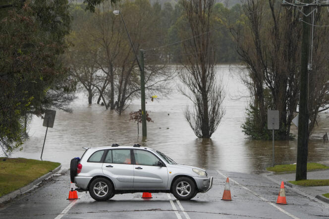 Access to a flooded street is blocked in Camden, Australia on July 4, 2022. 