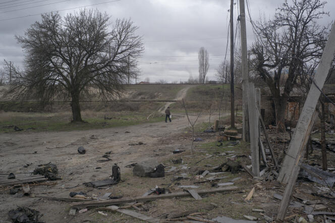 A man walks at the end of Ivano-Franka street, a few days after the withdrawal of Russian forces, in Bucha, April 10, 2022.