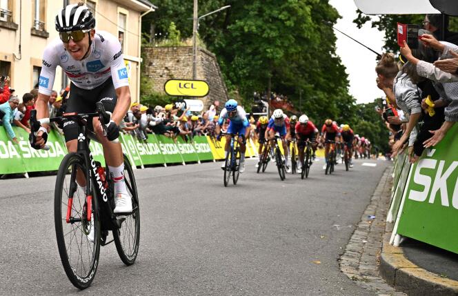 UAE Team Emirates team's Slovenian rider Tadej Pogacar cycles to the finish line to win the 6th stage of the 109th edition of the Tour de France cycling race, 219,9 km between Binche in Belgium and Longwy in northern France, on July 7, 2022.