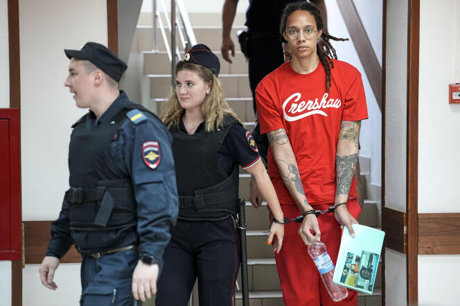 WNBA star and two-time Olympic gold medalist Brittney Griner is escorted to a courtroom for a hearing in Khimki, just outside Moscow, Russia, on Thursday, July 7, 2022.