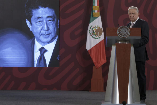 A photo of Japanese Prime Minister Shinzo Abe is displayed on the screen as Mexican President Andres Manuel Lopez Obrador offers his condolences at the National Palace in Mexico City following Mr. Abe's death, Friday, July 8, 2022.
