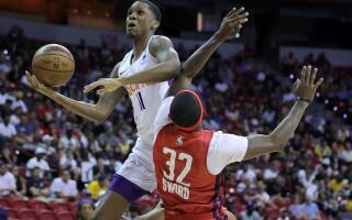 LAS VEGAS, NEVADA - JULY 10: Tyson Carter #11 of the Phoenix Suns is fouled as he drives to the basket by Craig Sword #32 of the Washington Wizards during the 2022 NBA Summer League at the Thomas & Mack Center on July 10, 2022 in Las Vegas, Nevada. NOTE TO USER: User expressly acknowledges and agrees that, by downloading and or using this photograph, User is consenting to the terms and conditions of the Getty Images License Agreement. Ethan Miller/Getty Images/AFP
== FOR NEWSPAPERS, INTERNET, TELCOS & TELEVISION USE ONLY ==