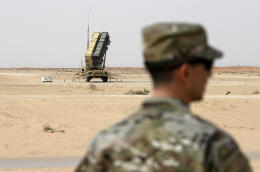 FILE - In this Feb. 20, 2020, file pool photo, a member of the U.S. Air Force stands near a Patriot missile battery at Prince Sultan Air Base in Saudi Arabia. The U.S. has removed its most advanced missile defense system and Patriot batteries from Saudi Arabia's Prince Sultan Air Base in recent weeks, even as the kingdom faced continued air attacks from Yemen's Houthi rebels, satellite photos analyzed by The Associated Press show. (Andrew Caballero-Reynolds/Pool via AP, File)