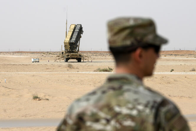 A US Air Force member stands near a Patriot missile battery at Prince Sultan Air Base in Saudi Arabia on Feb. 20, 2020.