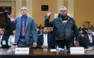 Stephen Ayres, who pleaded guilty last in June 2022 to disorderly and disruptive conduct in a restricted building, left, and Jason Van Tatenhove, an ally of Oath Keepers leader Stewart Rhodes, are sworn in to testify as the House select committee investigating the Jan. 6 attack on the U.S. Capitol holds a hearing at the Capitol in Washington, Tuesday, July 12, 2022. (Demetrius Freeman//The Washington Post via AP, Pool)